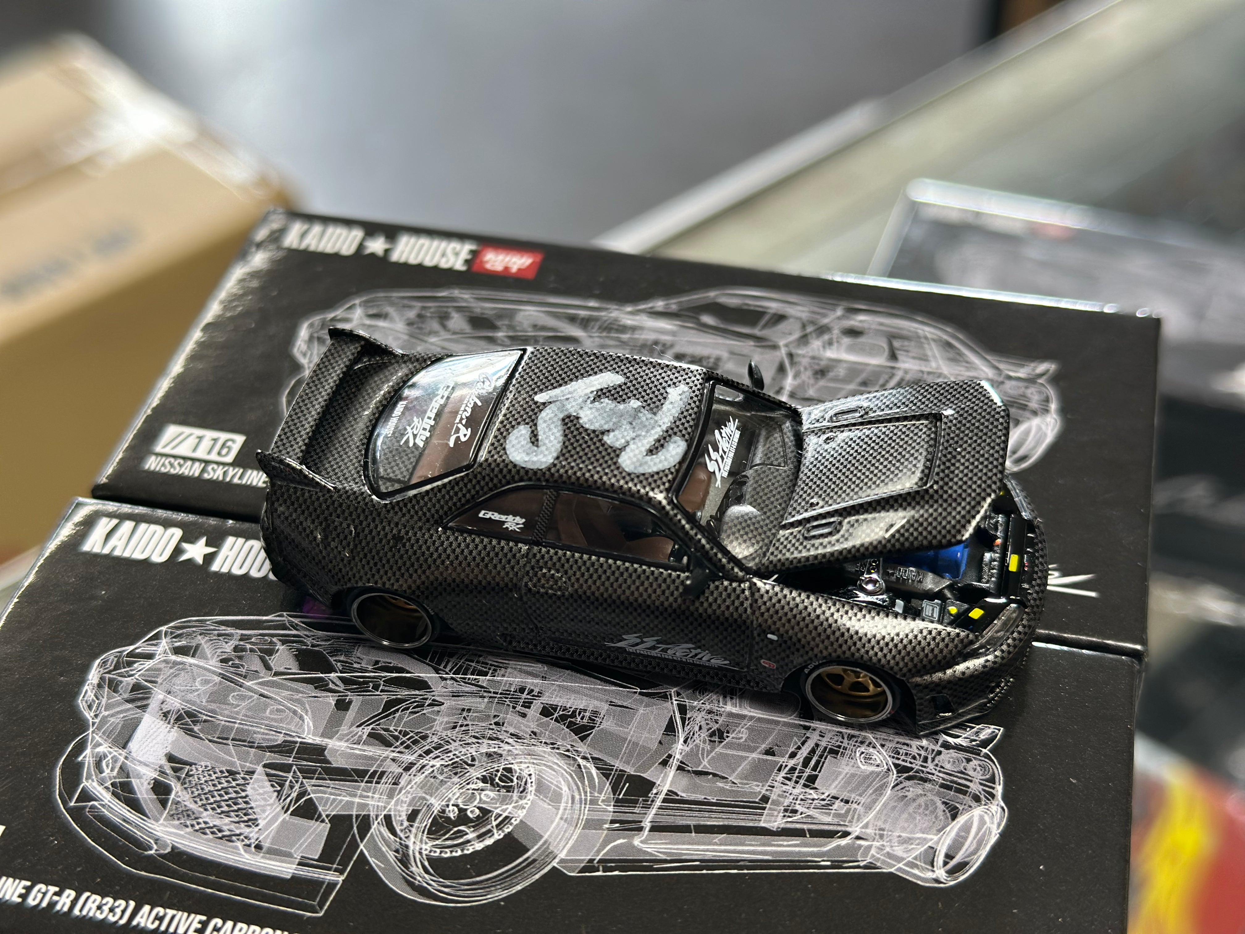 Kaido House x Nissan Skyline GT-R (R33) Active Carbon R 1/64 (Signed)